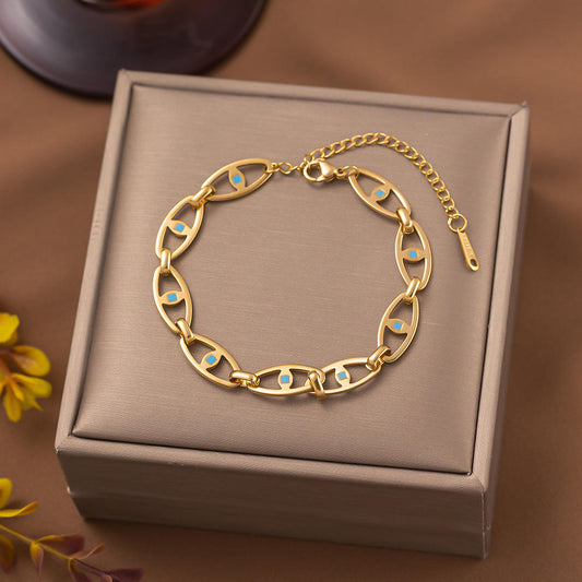 Close-up of Orek Devra Evil Eye Bracelet bracelet detail, a protective evil eye charm set along a 