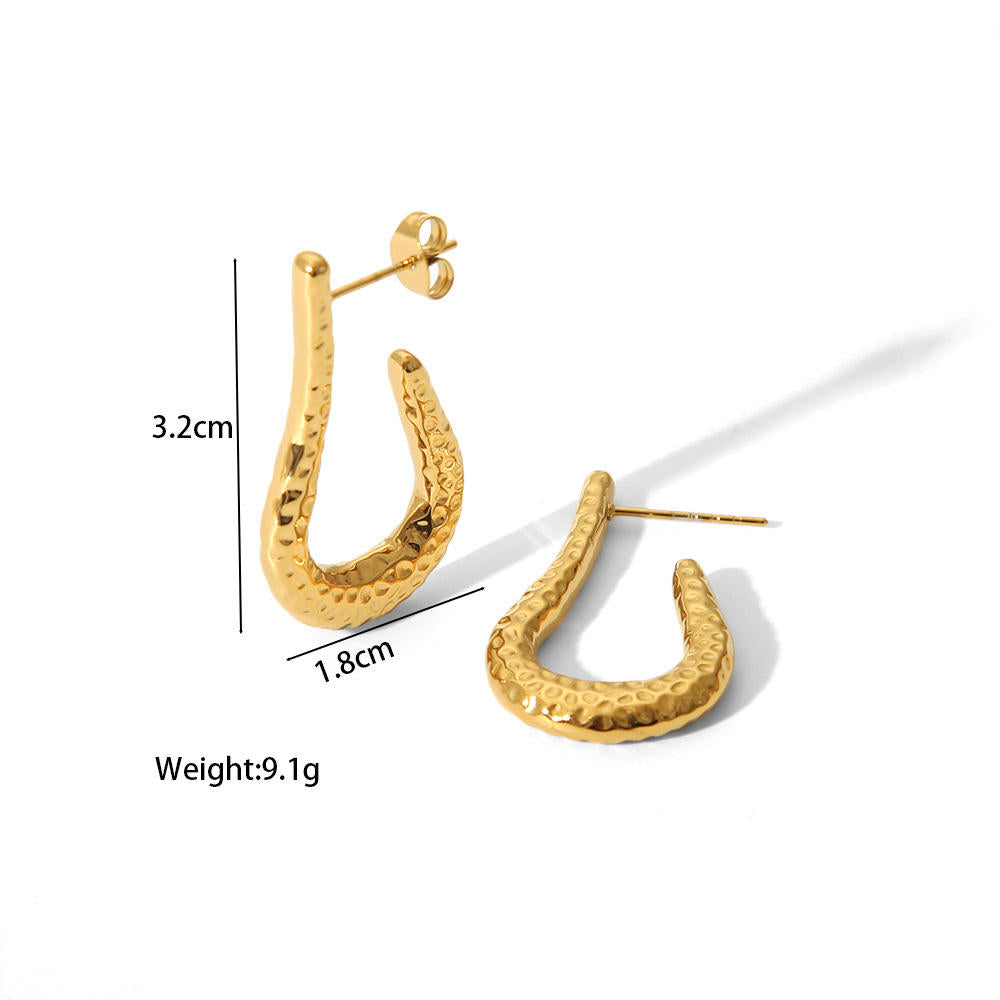 Orek Kira Hammered U Earrings Deluxe earrings on jewellery display, a fuller, U-shaped silhouette with a dee
