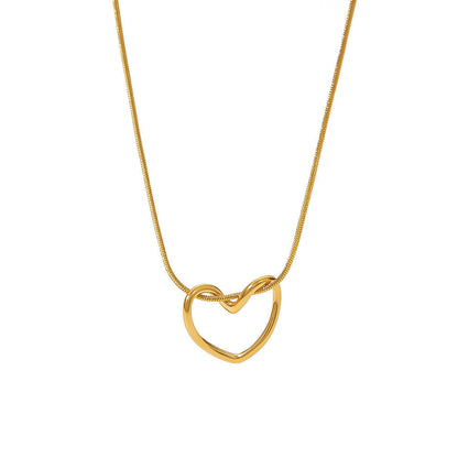 Orek Arelia Pure Heart Necklace necklace on jewellery display, a hollow-out heart pendant on a delicate