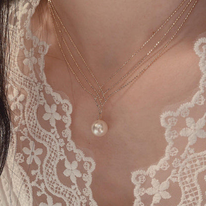Orek Luna Siren Pearl Necklace worn — pendant necklaces for Festive