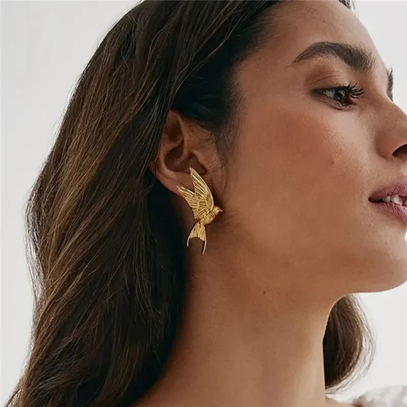 Close-up of Orek Elara Peace Kingfisher Wing Earring earrings detail, a sculpted wing silhouette inspired by p