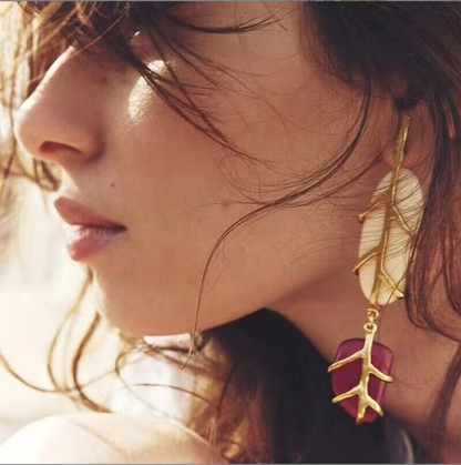 Orek Solene Boho Leaf Dangler earrings on jewellery display, a casual, resin-accented leaf silhouette
