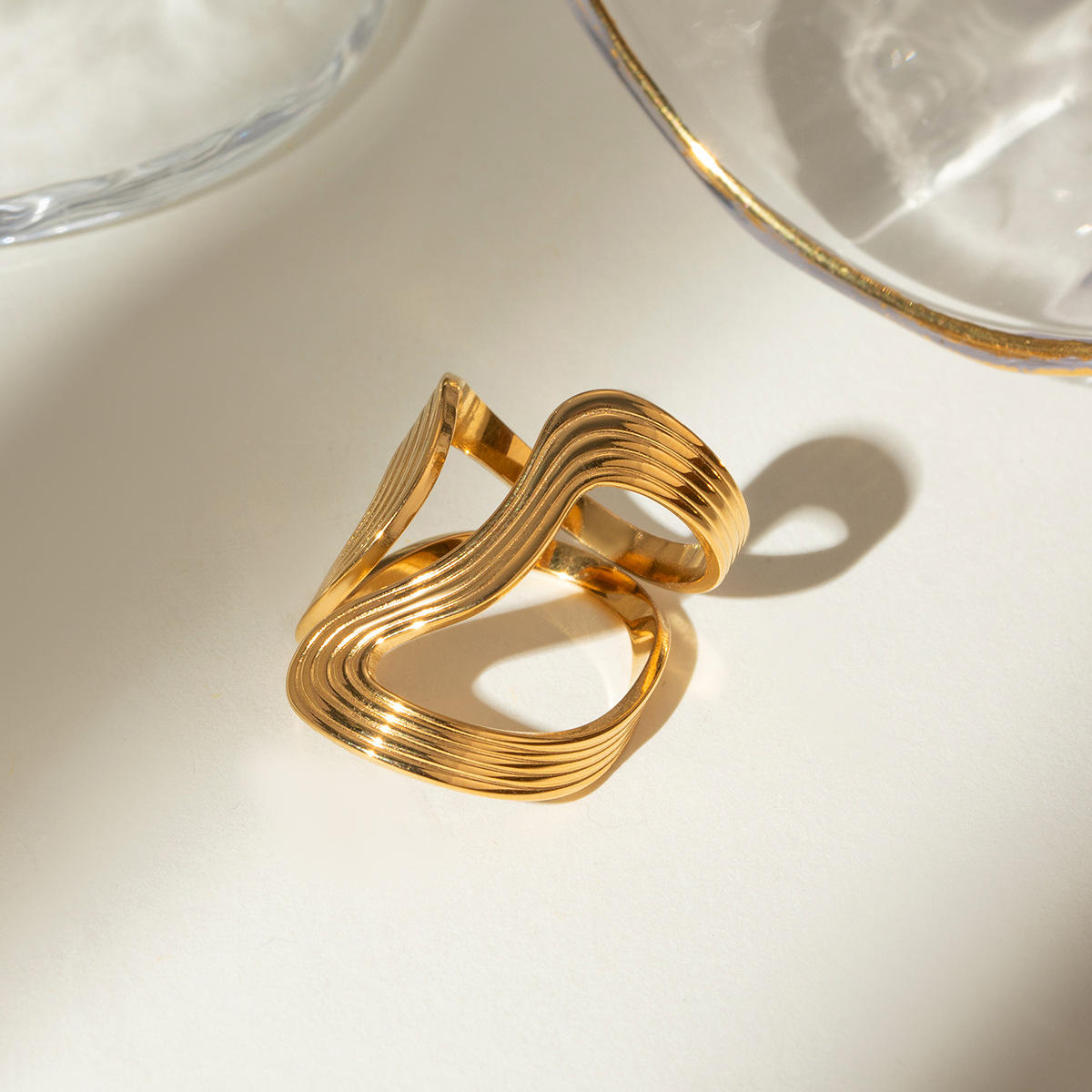 Close-up of Orek Sena Smooth Line Ring ring detail, a slim, high-polish line that curves cle