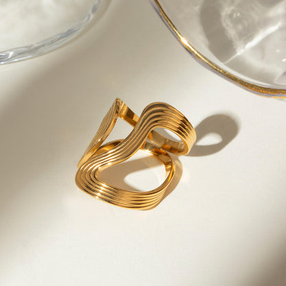 Close-up of Orek Sena Smooth Line Ring ring detail, a slim, high-polish line that curves cle