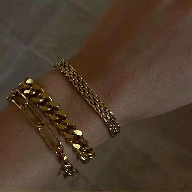 Close-up of Orek Flat Paperclip Bracelet bracelet detail, chunky, flat rectangle links in a paperc