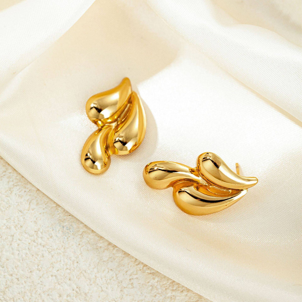 Orek Golden Swirl Drop Earrings earrings styled with everyday outfit