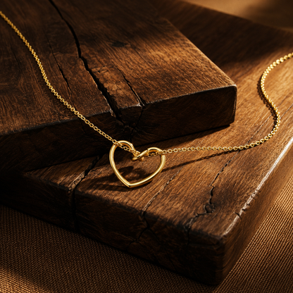 Close-up of Orek Arelia Pure Heart Necklace necklace detail, a hollow-out heart pendant on a delicate