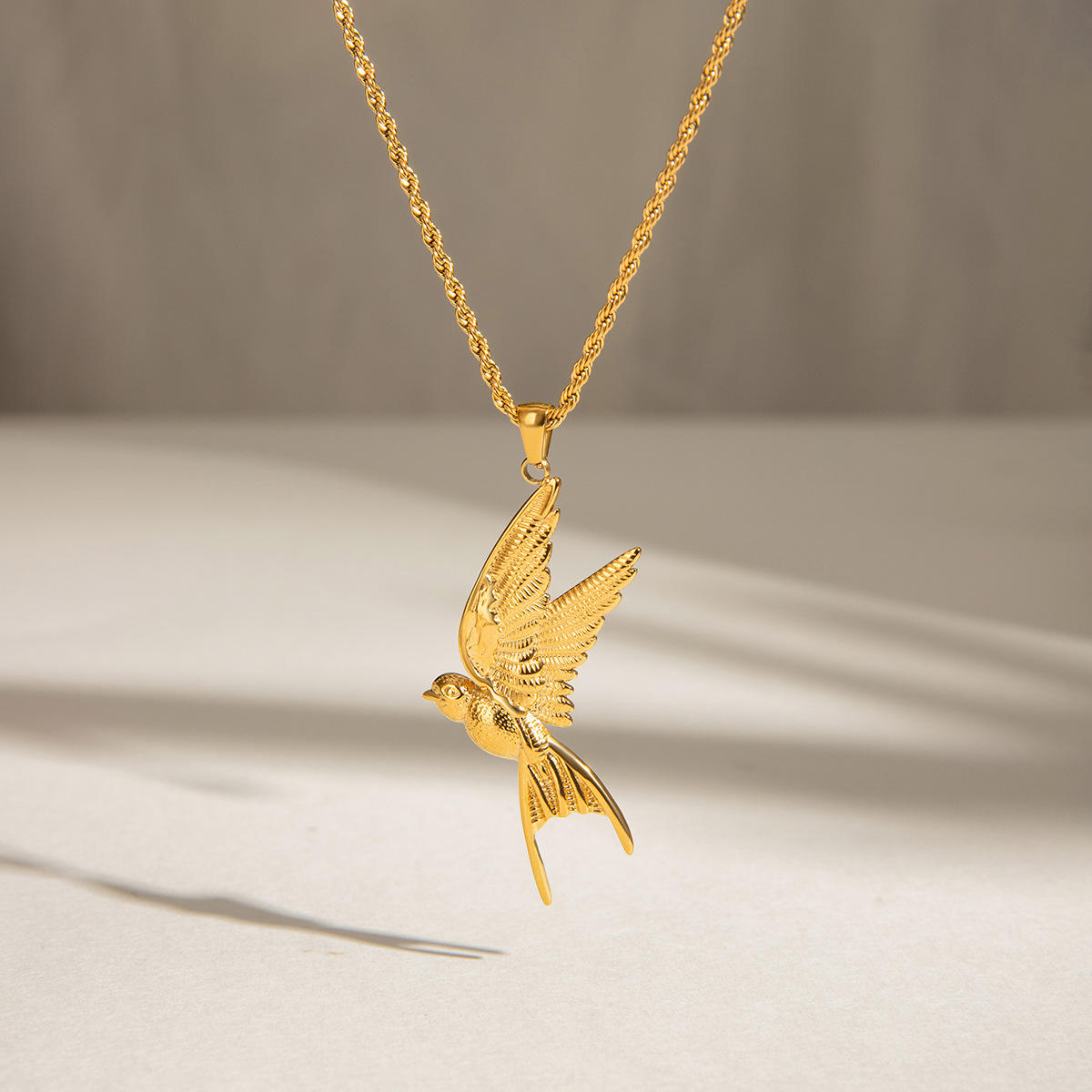Close-up of Orek Ciela Dove Whisper Necklace, showing anti-tarnish gold plated finish