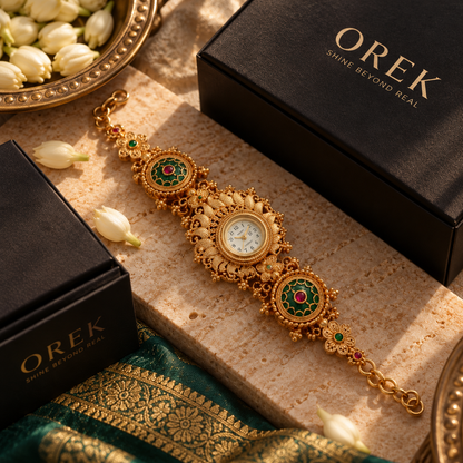 Rajshree Traditional Gold Bracelet Watch with Green & Ruby Red Stone Details | Orek Jewellery