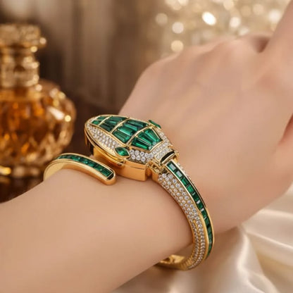 Orek Emerald Serpent Watch with emerald green detailing and gold-tone finish