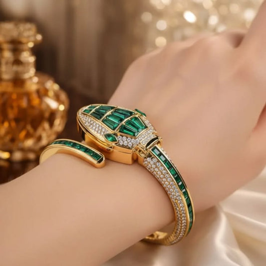 Orek Emerald Serpent Watch with emerald green detailing and gold-tone finish