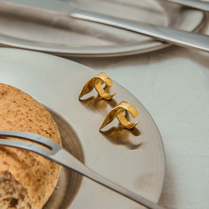 Close-up of Orek Aira Mermaid Curve Earcuffs showing curved design