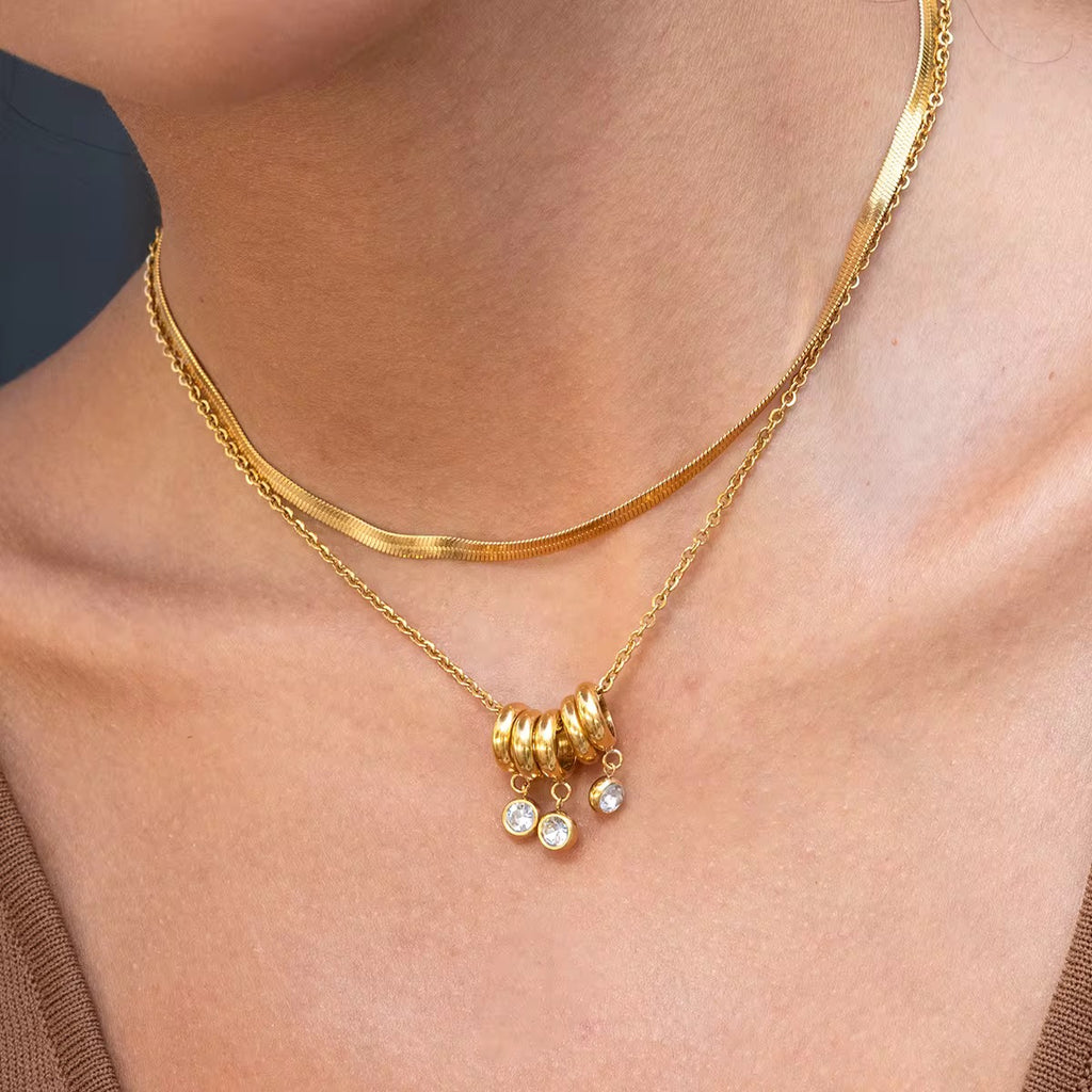 Close-up of Orek Aira Serpent Line Necklace, showing anti-tarnish gold plated finish
