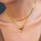 Close-up of Orek Aira Serpent Line Necklace, showing anti-tarnish gold plated finish