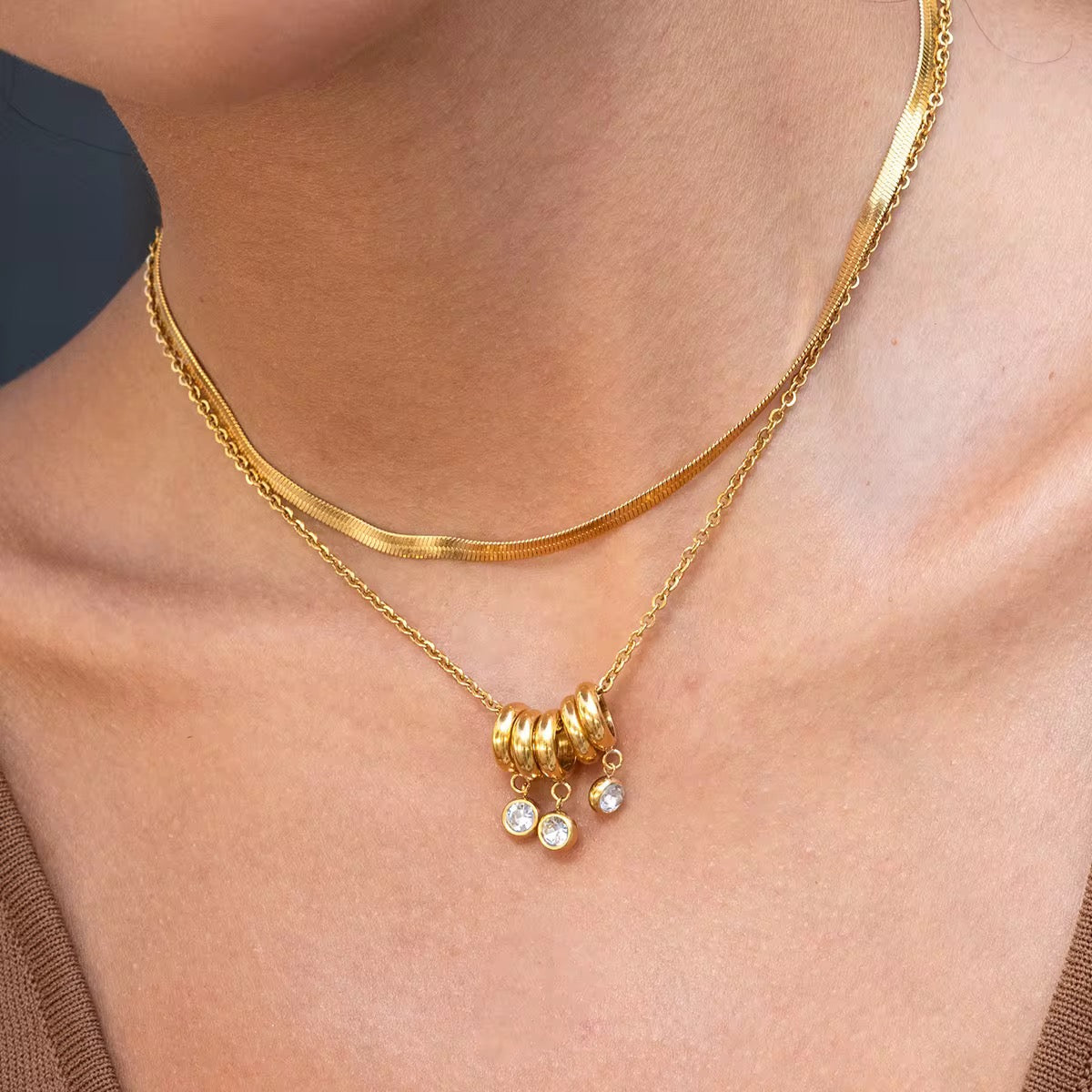 Close-up of Orek Aira Serpent Line Necklace, showing anti-tarnish gold plated finish