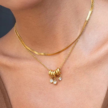 Close-up of Orek Aira Serpent Line Necklace, showing anti-tarnish gold plated finish