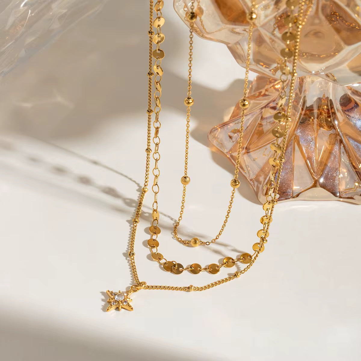 Front view of Orek Aira Star Layers Necklace with star pendant