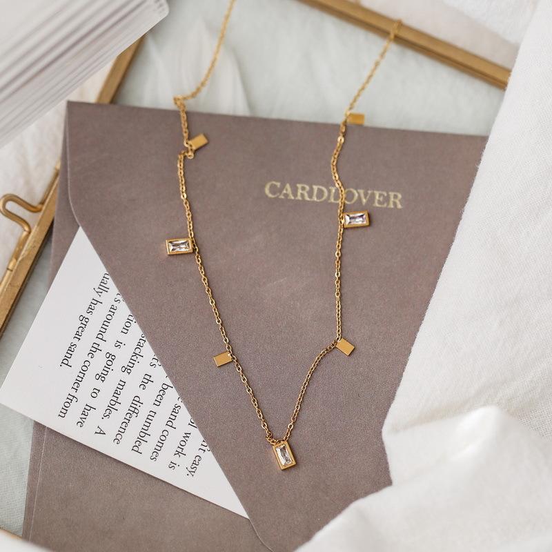 Close-up of Orek Arelia Square Poise Necklace geometric square pendant