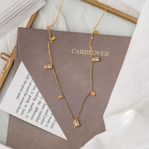 Close-up of Orek Arelia Square Poise Necklace geometric square pendant