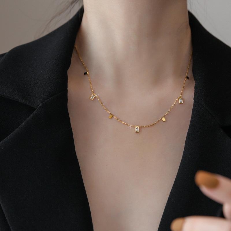 Woman wearing Orek Arelia Square Poise Necklace for office wea