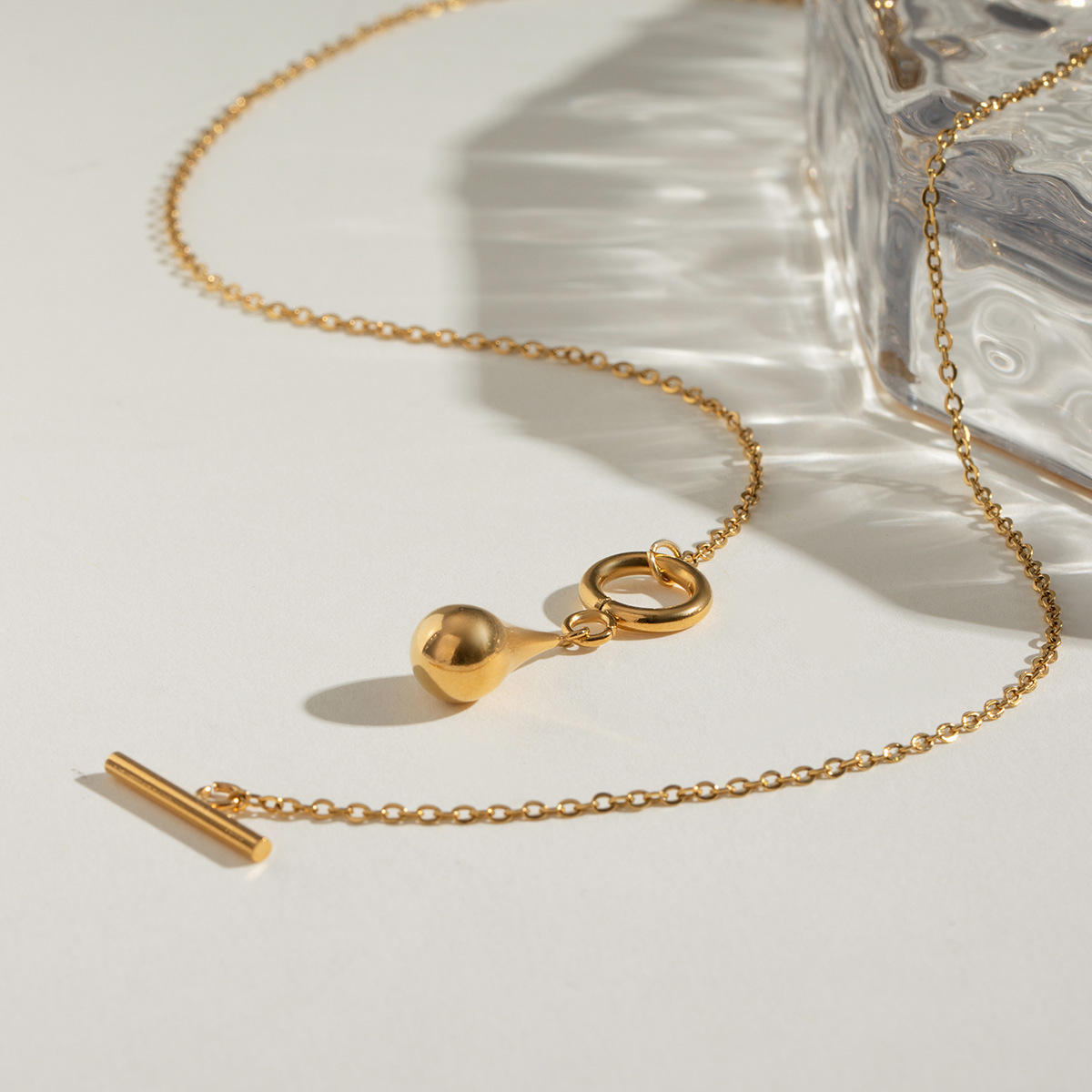 Close-up view of the Orek Ciela Drop Knot Necklace showing the elegant gold knot pendant with premium anti-tarnish finish and stainless steel construction.
