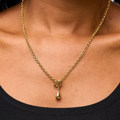 Model wearing the Orek Ciela Drop Knot Necklace styled with casual fashion, showcasing a minimal waterproof gold pendant necklace for women.