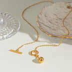 Orek Ciela Drop Knot Necklace for women featuring a waterproof anti-tarnish gold knot pendant crafted with premium 2.5 micron gold plated hypoallergenic stainless steel.