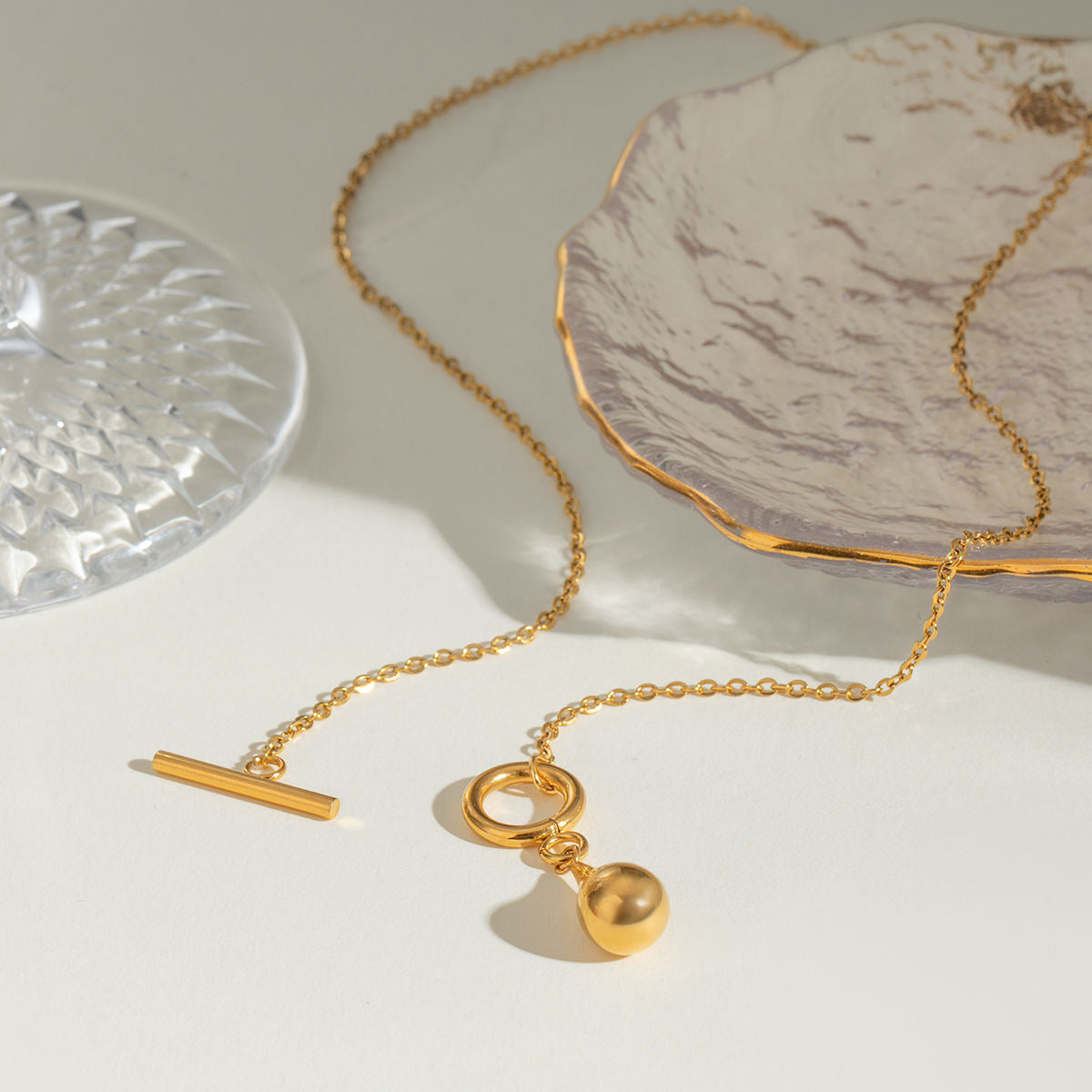 Orek Ciela Drop Knot Necklace for women featuring a waterproof anti-tarnish gold knot pendant crafted with premium 2.5 micron gold plated hypoallergenic stainless steel.