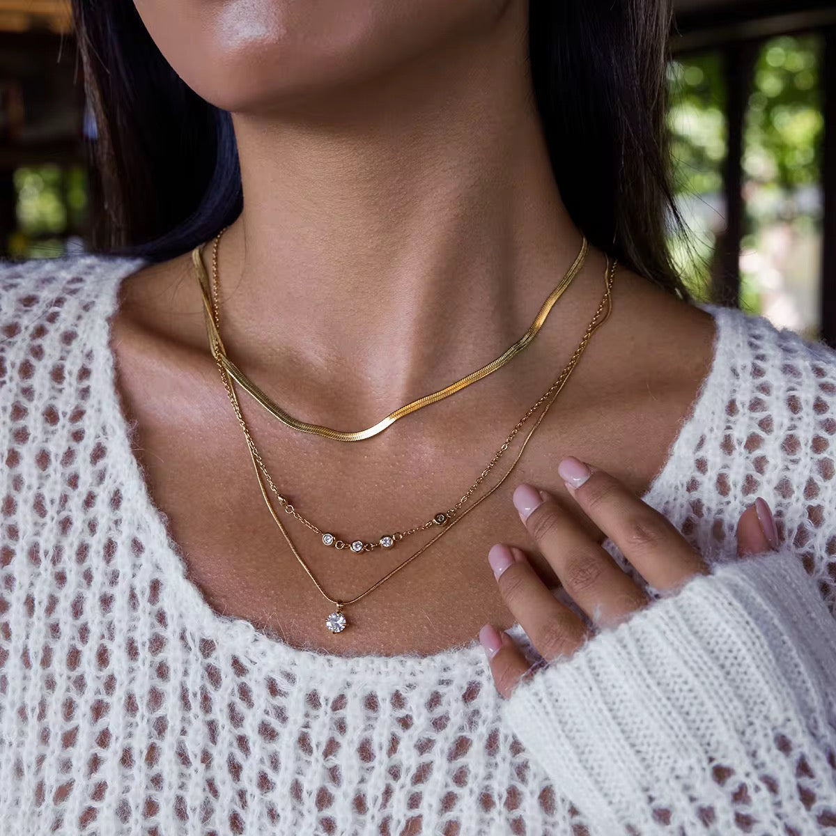Close-up of Orek Elia Luxe Layers Necklace, showing anti-tarnish gold plated finish