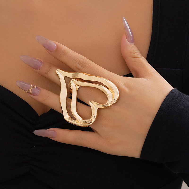 Woman wearing Orek Eternal Flow Heart Ring with minimalist styling