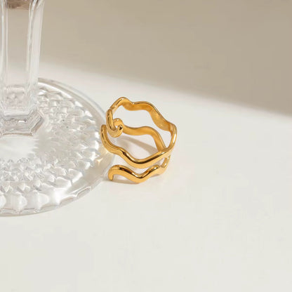 Close-up of Orek Flow Ring with sculptural wave design