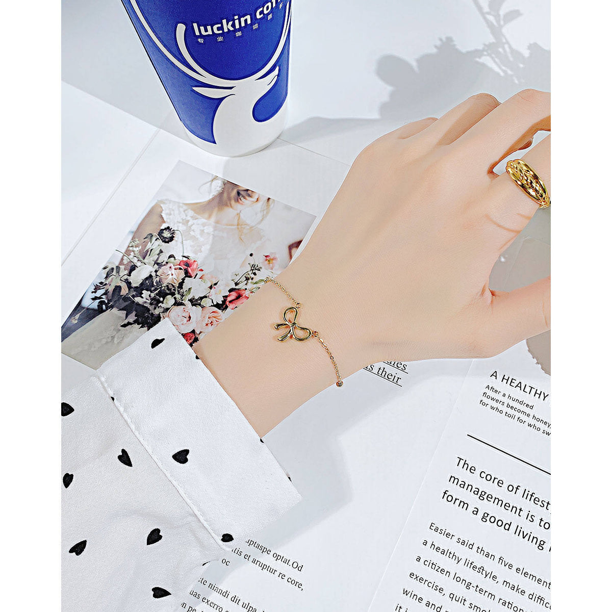 Close-up of Orek Golden Bow Charm Bracelet with premium 2.5 micron gold plating