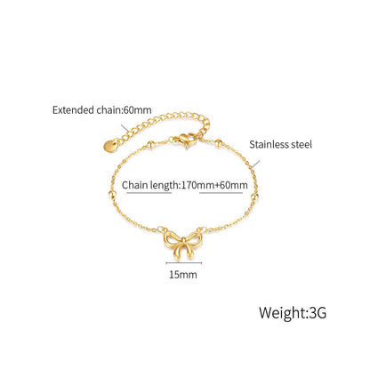 Detailed view of Orek Golden Bow Charm Bracelet showing elegant bow charm design