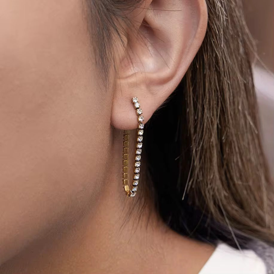 Close-up of Orek Ira Drop Glow Earrings showing chain drop design