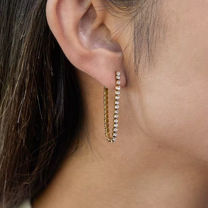Model wearing Orek Ira Drop Glow Earrings
