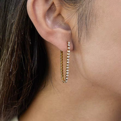 Model wearing Orek Ira Drop Glow Earrings