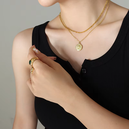 Close-up of Orek Layered Gold Coin Pendant Necklace with coin pendant