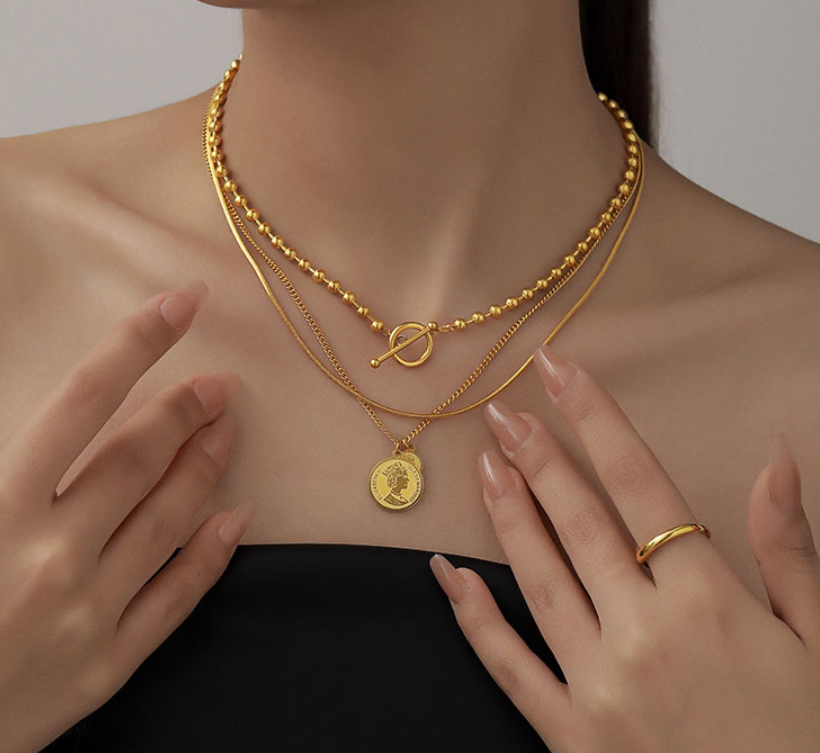 Woman wearing Orek Layered Gold Coin Pendant Necklace with everyday styling