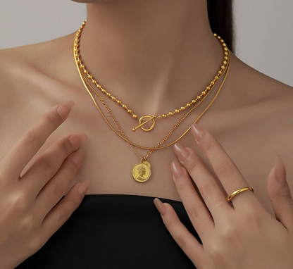 Woman wearing Orek Layered Gold Coin Pendant Necklace with everyday styling