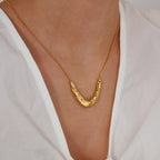 Close-up of Orek Oria Hammered Calm Necklace, showing anti-tarnish gold plated finish