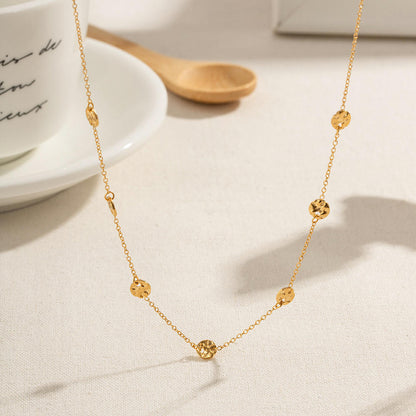 Close-up of the Orek Oria Hammered Dots Necklace showing premium hammered gold dot detailing and anti-tarnish finish.