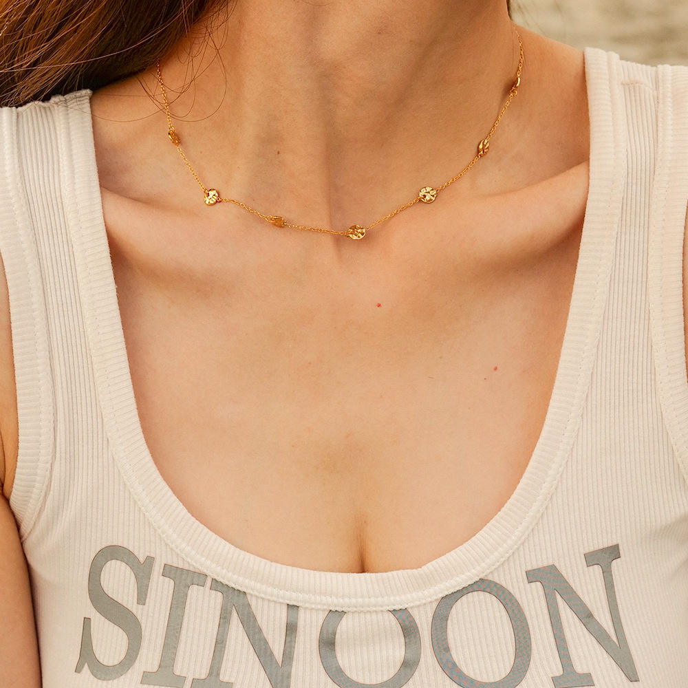 Model wearing the Orek Oria Hammered Dots Necklace styled as a minimal waterproof gold necklace for everyday and office wear.