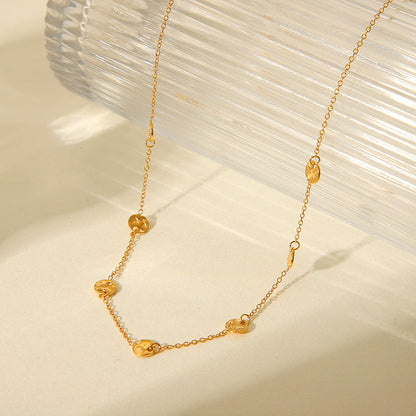 Premium detail image of the Orek Oria Hammered Dots Necklace crafted with 2.5 micron gold plating, waterproof anti-tarnish finish, and hypoallergenic stainless steel.