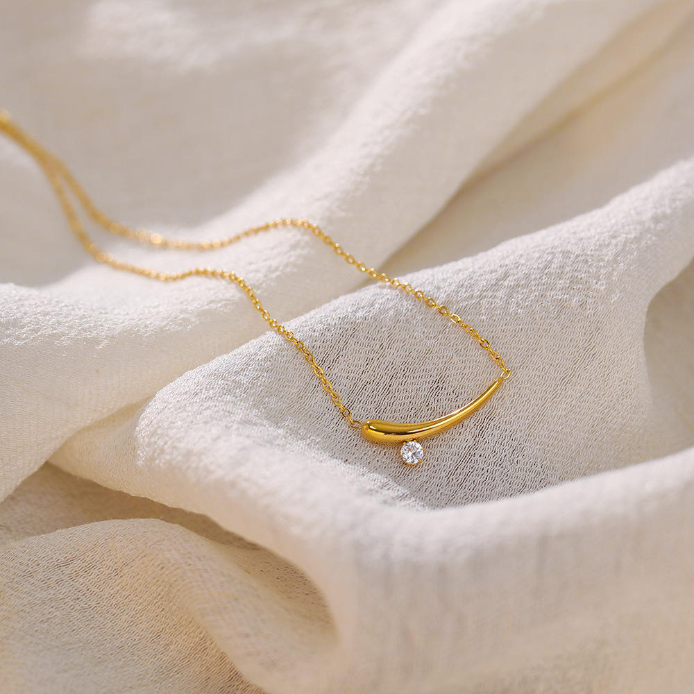 Close-up of Orek Solyn Crescent Grace Necklace crescent pendant