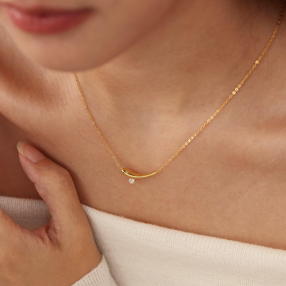 Woman wearing Orek Solyn Crescent Grace Necklace for office wear