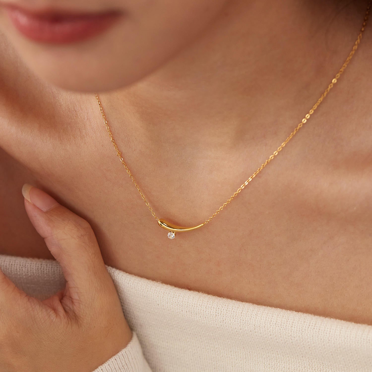 Woman wearing Orek Solyn Crescent Grace Necklace for office wear