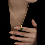 Woman wearing Orek Veya Emerald Poise Necklace with elegant everyday styling