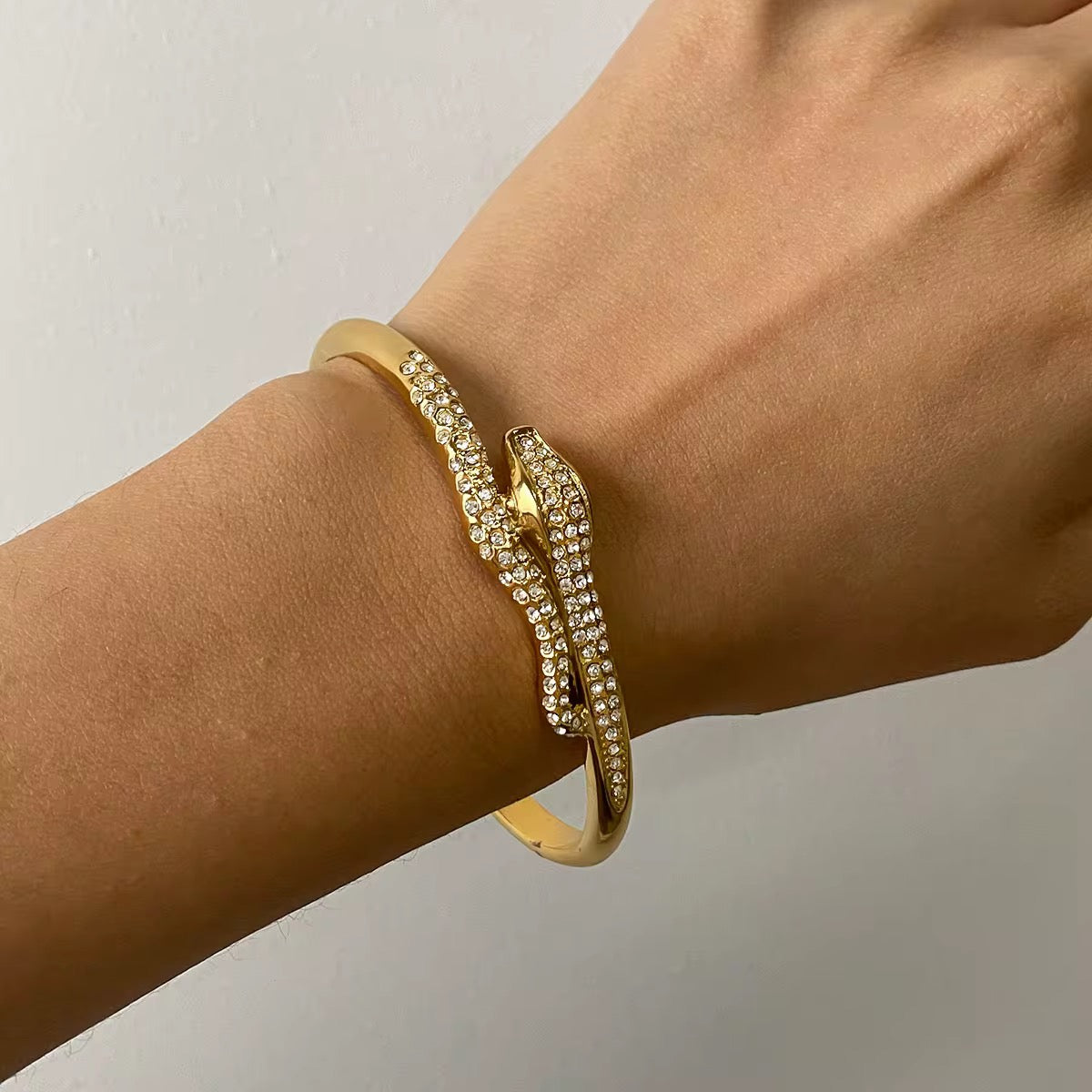 Front view of Orek Zeni Serpent Arc Bangle